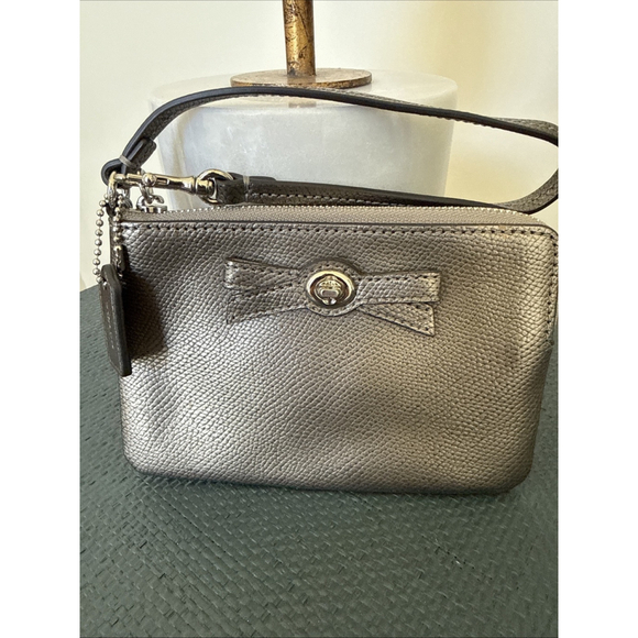 Coach Handbags - COACH Corner Zip Leather Wristlet Handbag Small Metallic Silver Bow 6”x 4”